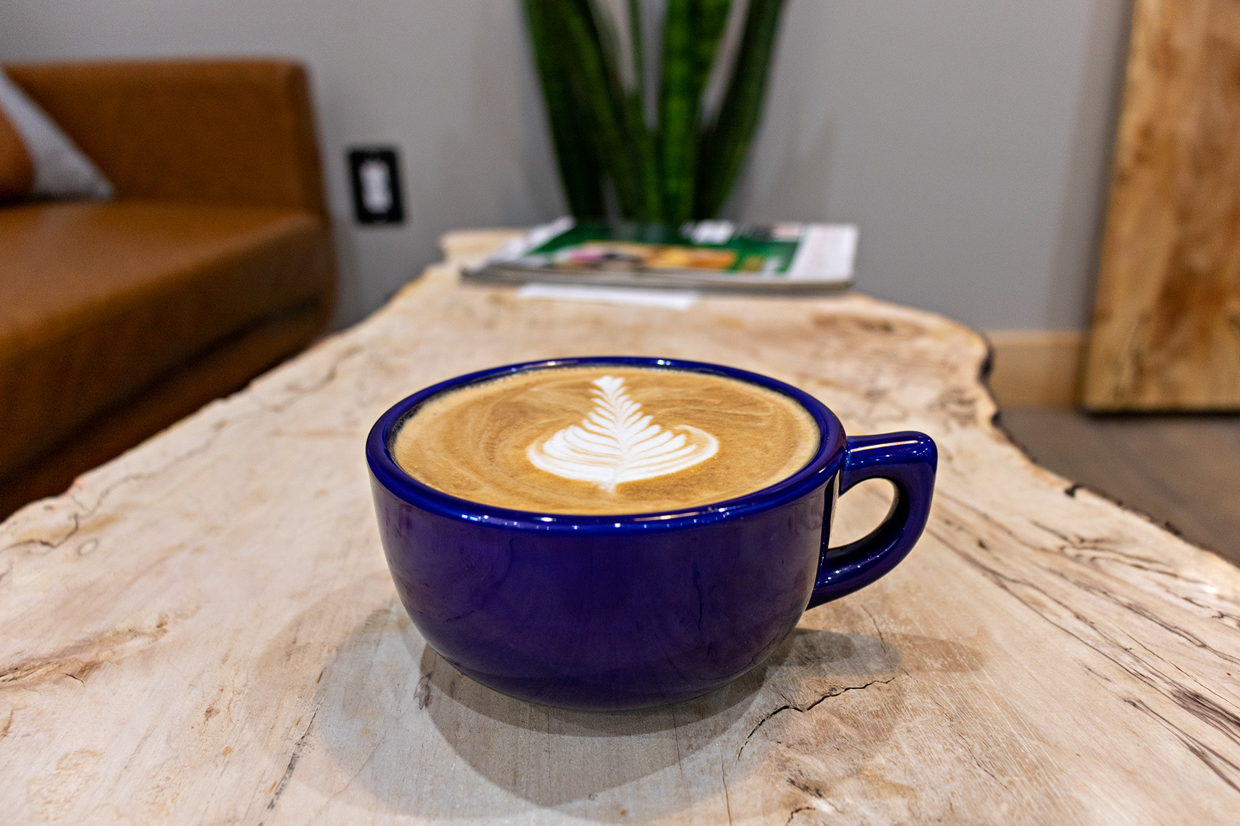 Latte art in a blue mug